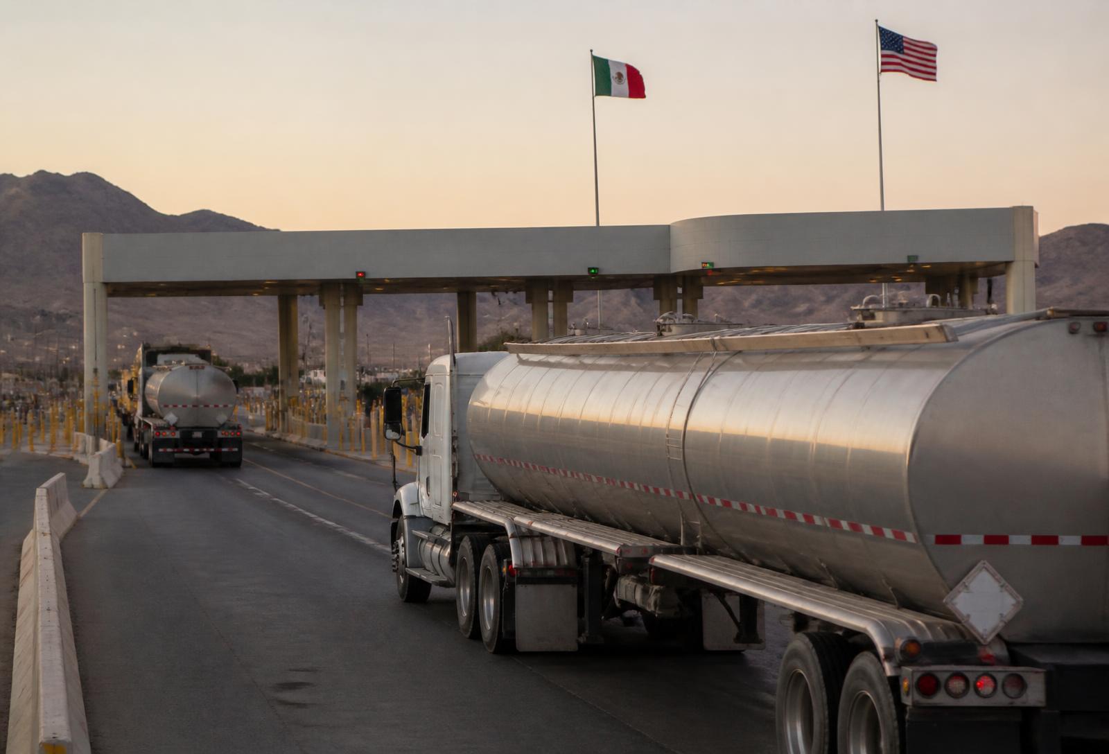 Fuel tanker trucks approaching a U.S.–Mexico border crossing
